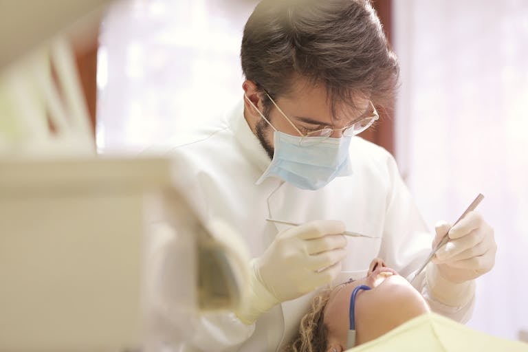 dentist practicing with a patient